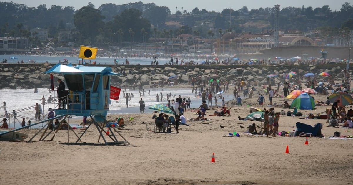 Colored warning flag flying on a lifeguard-patrolled beach